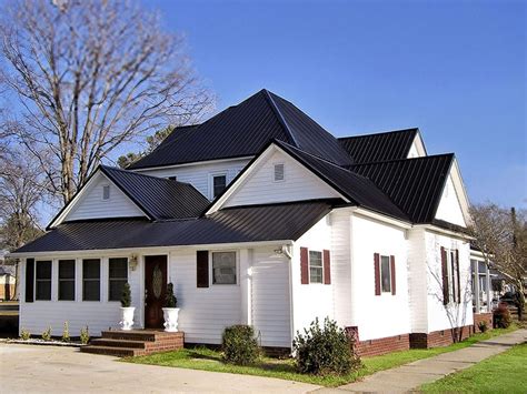 white house black metal roof